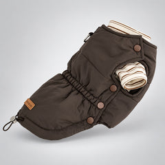 Angled view of the brown padded dog vest layered over a cream striped shirt, with side snaps and a gathered waist.