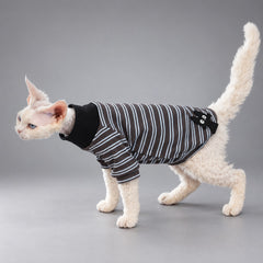 Cat wearing the Black Charcoal Stripe T-shirt, walking in side view.