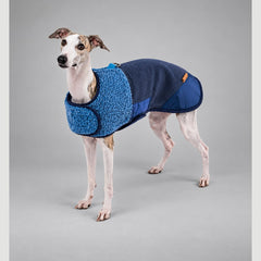 Dog wearing the Deep Navy Heritage sherpa coat, standing in side view.