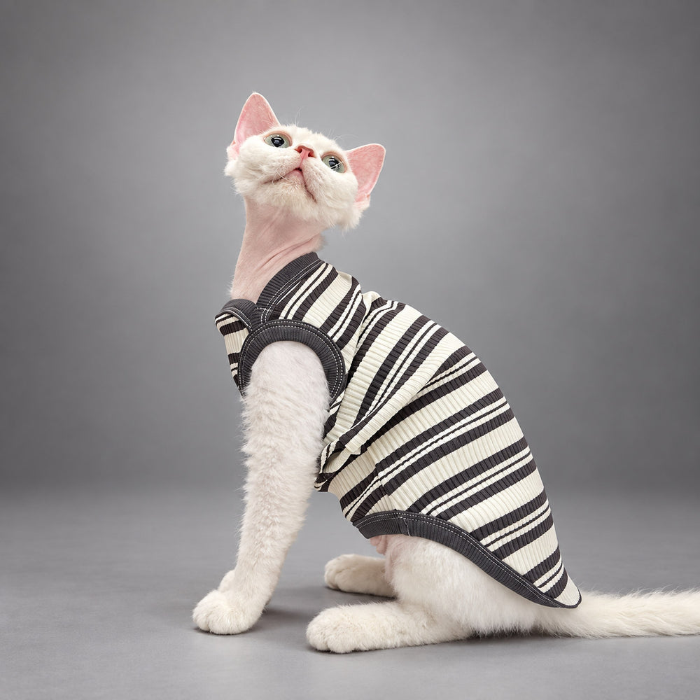 Cat wearing the Black & Ivory Stripe Monochrome Ease vest, seated in side view.