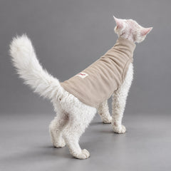 Cat wearing the Soft Taupe vest, standing in rear view.