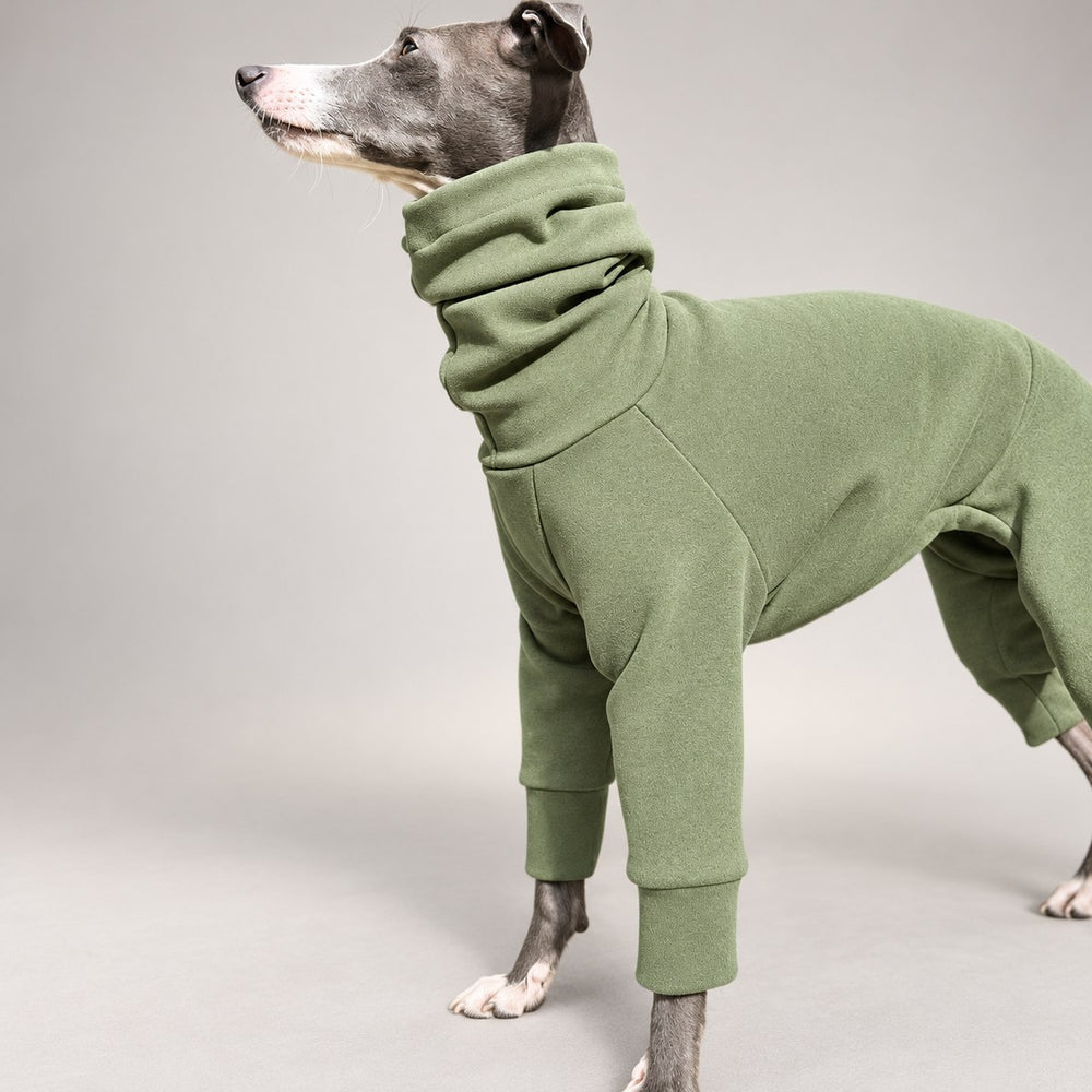 Close-up of the sage green onesie's high neckline, brushed texture and front sleeve.