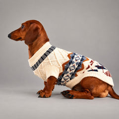 Dog wearing the Cream Ivory vintage Fair Isle sweater, seated in side view.
