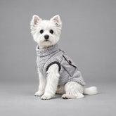 Dog wearing the Charcoal Gray vintage sherpa vest, seated in side view.