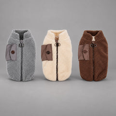 Vintage sherpa dog vests in Charcoal Gray, Camel Brown and Mocha Brown shown upright.