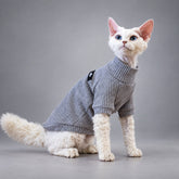 Cat wearing the Aby Gray waffle cotton shirt, seated in side view.