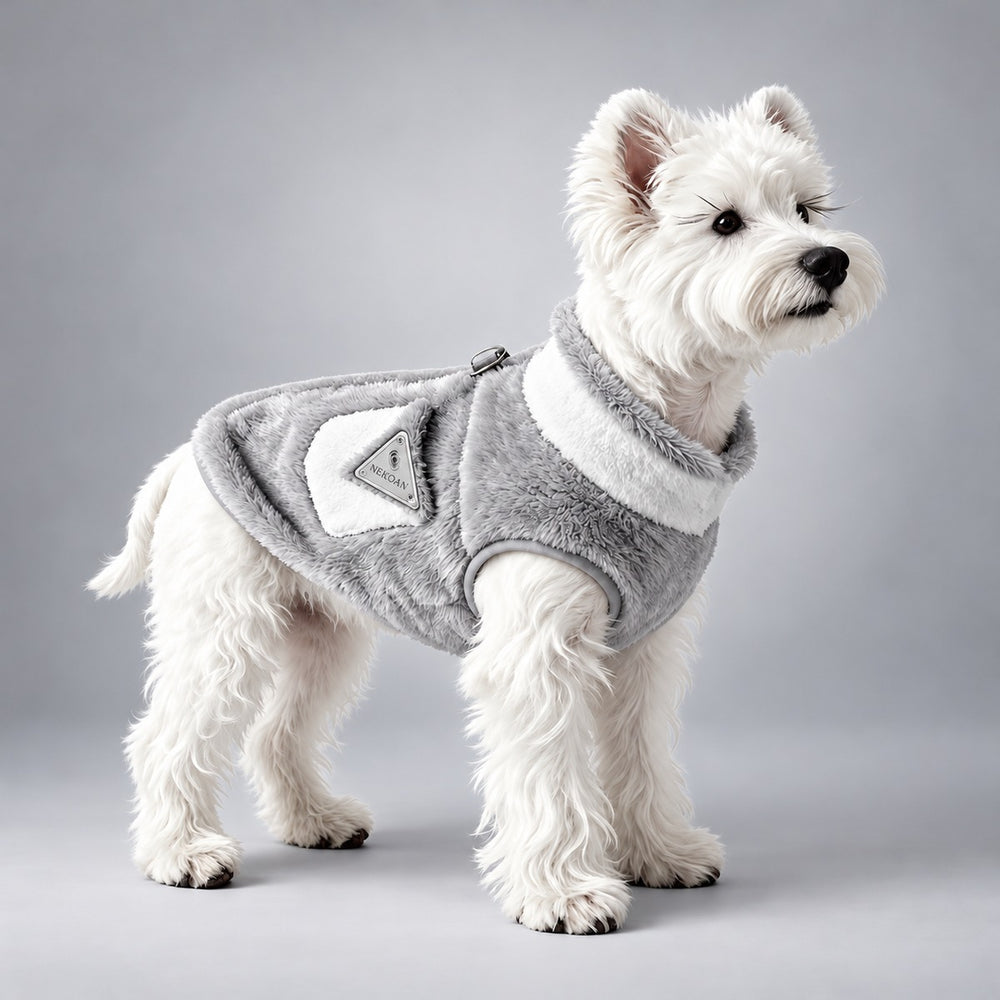 White terrier wearing the gray and white Arctic fleece dog coat.