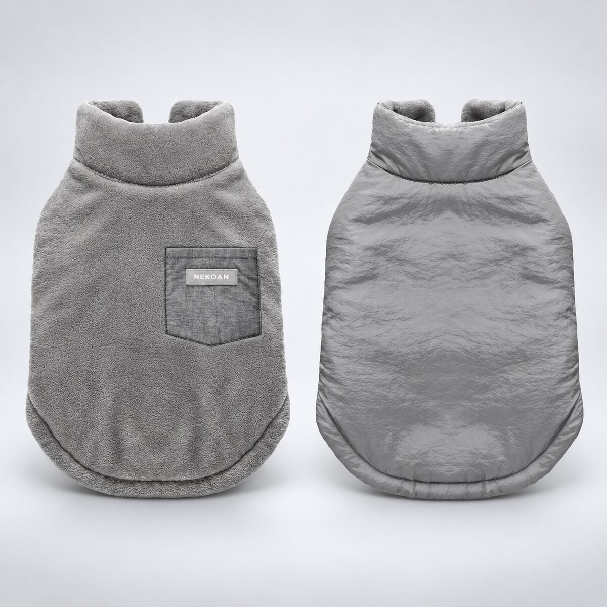 Gray reversible dog coat showing the plush flannel side and crinkled shell side.
