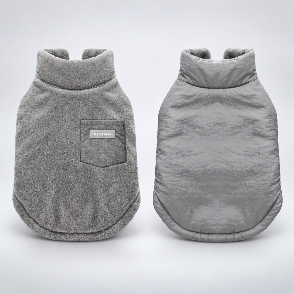 Gray reversible dog coat showing the plush flannel side and crinkled shell side.