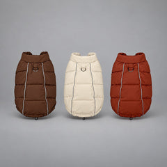 Winter dog puffer vests in Mocha Brown, Soft Beige and Brick Red, shown together from the back.