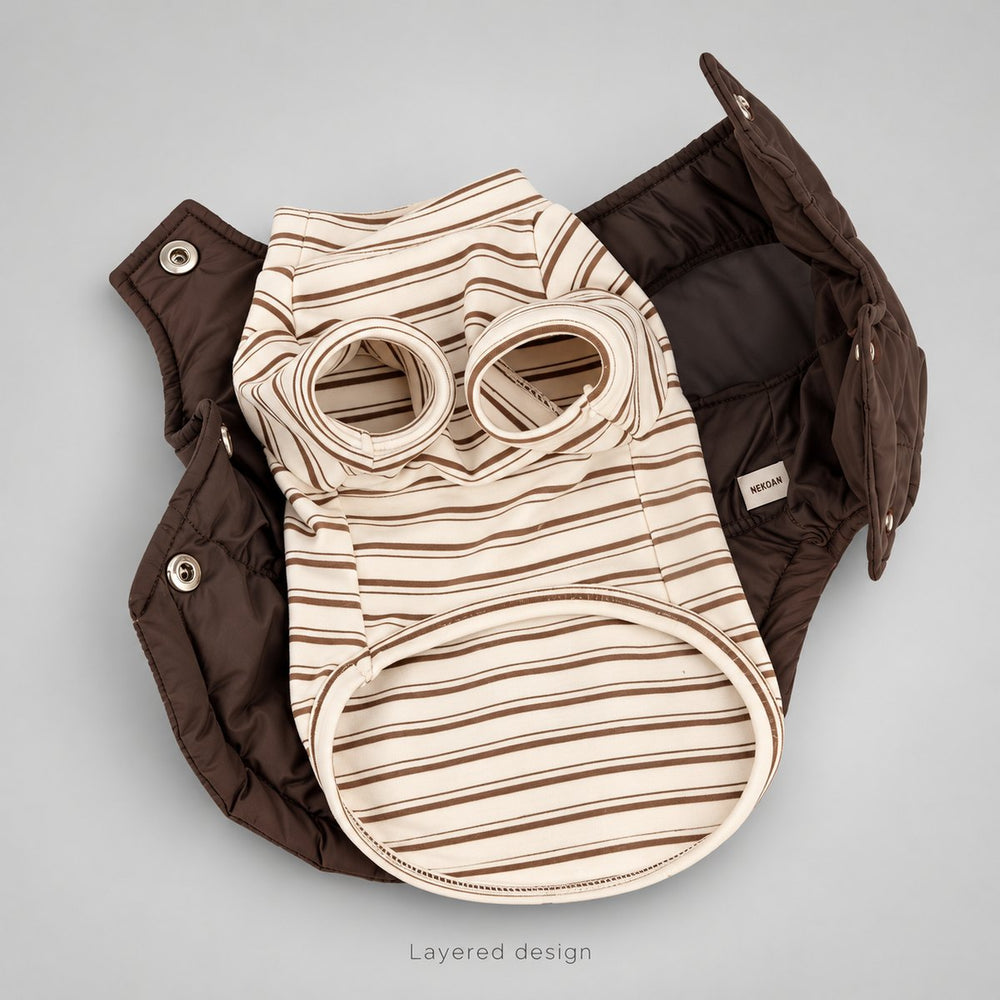 Open brown vest with the cream striped shirt laid inside, showing the separate layers and snap hardware.