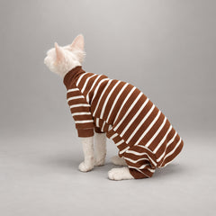 Cat wearing the Caramel Brown Cocoa Stripe onesie, seated in rear view.