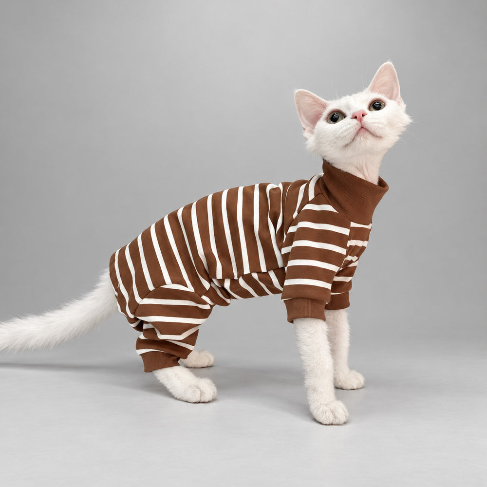 Cat wearing the Caramel Brown Cocoa Stripe onesie, standing in side view.