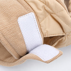 Close-up of the adjustable hook-and-loop neck fastening