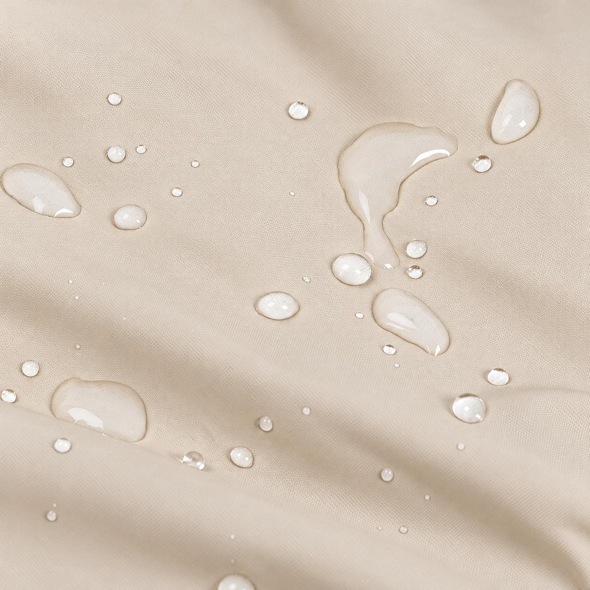 Water droplets beading on the coat's water-repellent nylon fabric