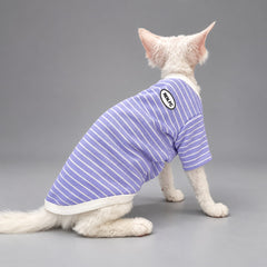 Cat wearing the Lavender Stripe crewneck shirt, seated in rear view.