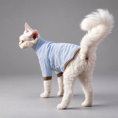 Cat wearing the Nordic Blue Mist & Brown T-shirt, standing in side view.