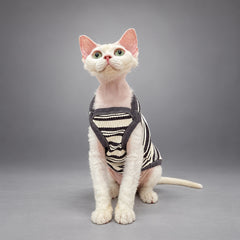 Cat wearing the Black & Ivory Stripe Monochrome Ease vest, seated facing the camera.