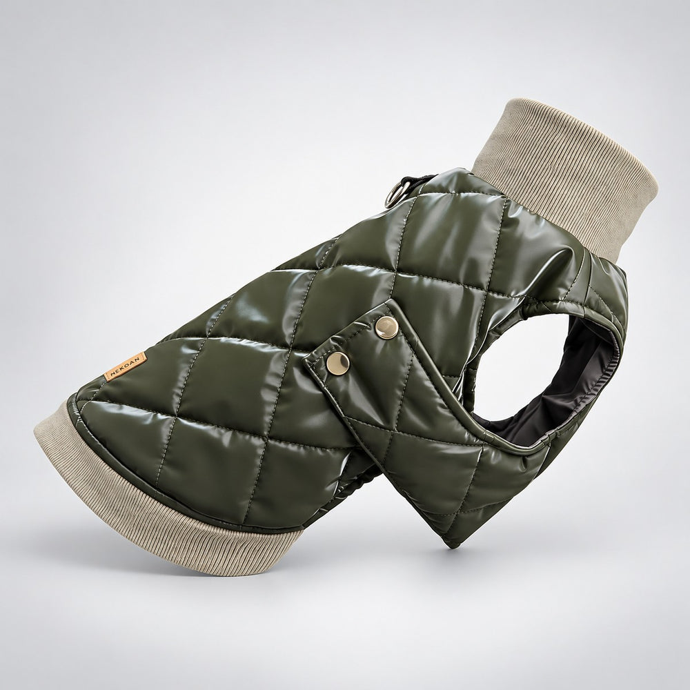 Angled view of the padded olive dog vest with diamond quilting and gold-tone side snaps.