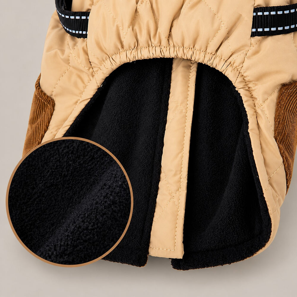 Close-up of the Beige quilted harness dog coat showing the soft black fleece lining and bound arm opening.