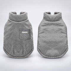Gray reversible dog coat showing the flannel side and smooth shell side.