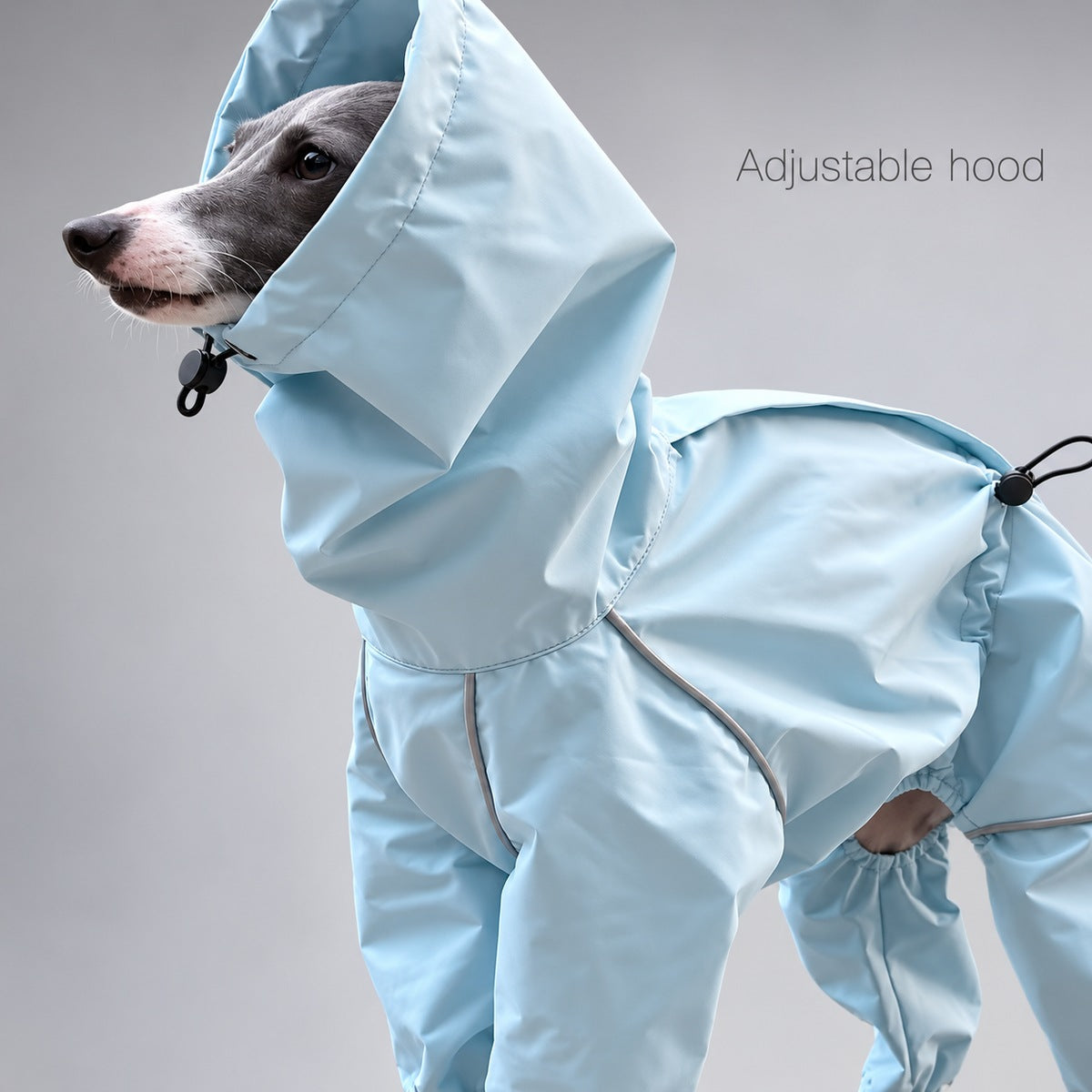 Close-up of the light blue rain suit's adjustable hood, black drawcord and toggle.