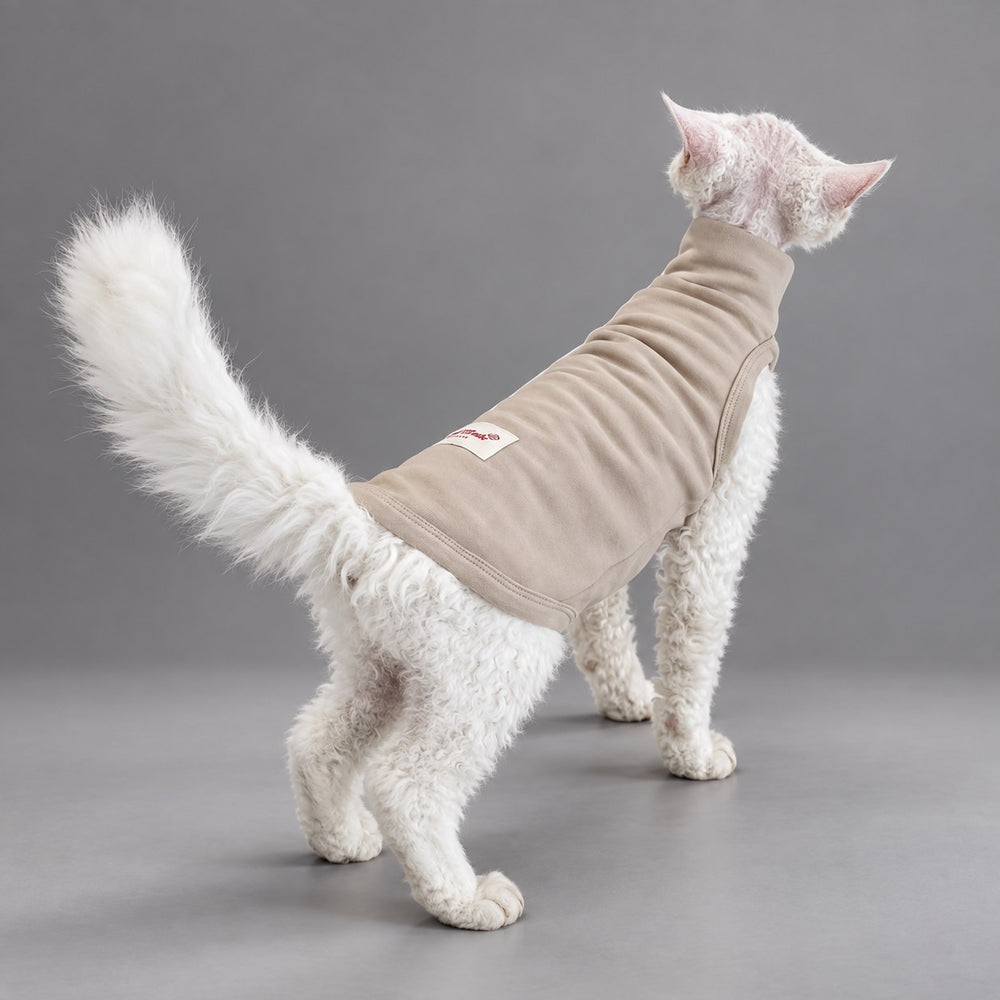 Cat wearing the Soft Taupe vest, standing in rear view.