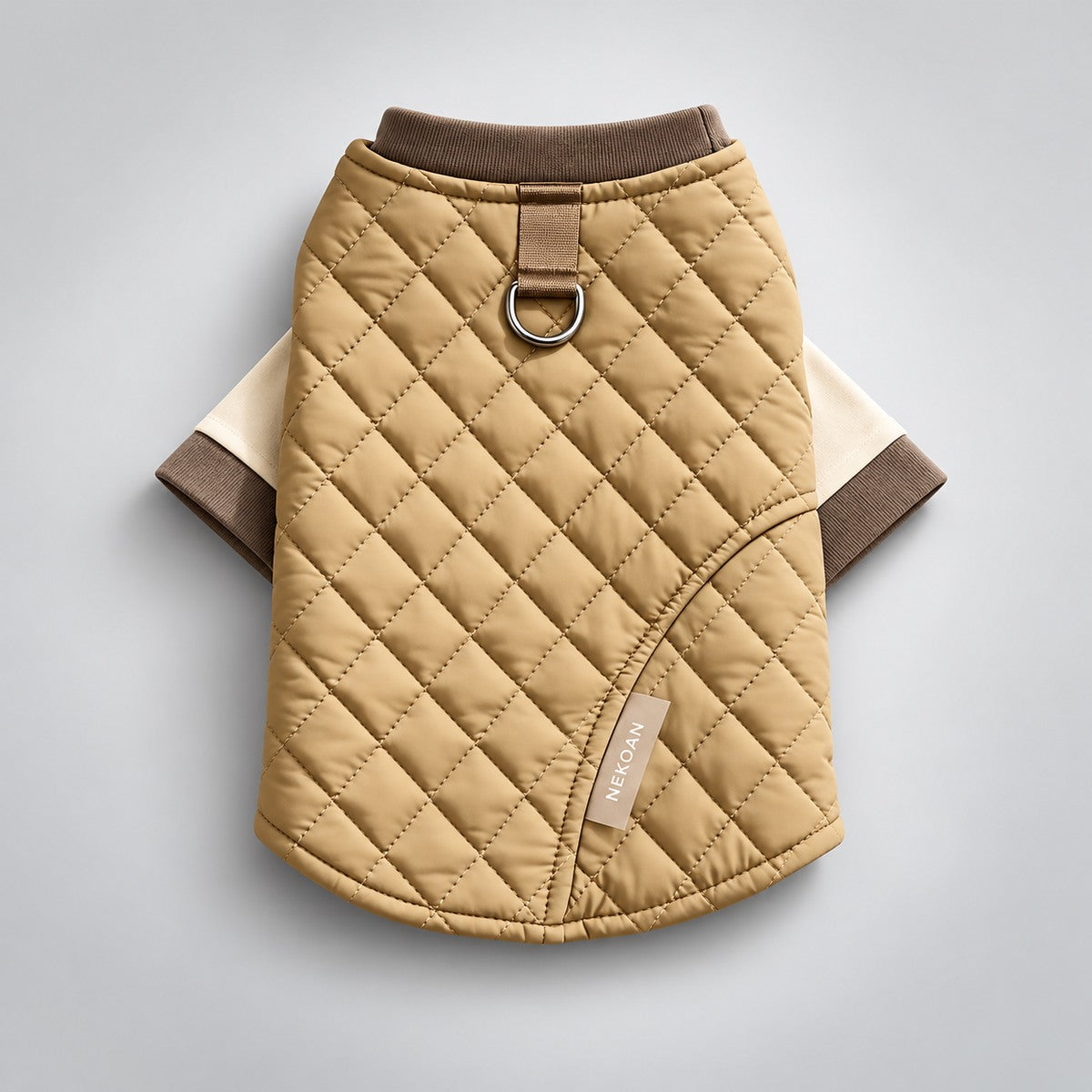 Back view of the two-piece dog outfit with diamond quilting and the cream T-shirt sleeves visible.