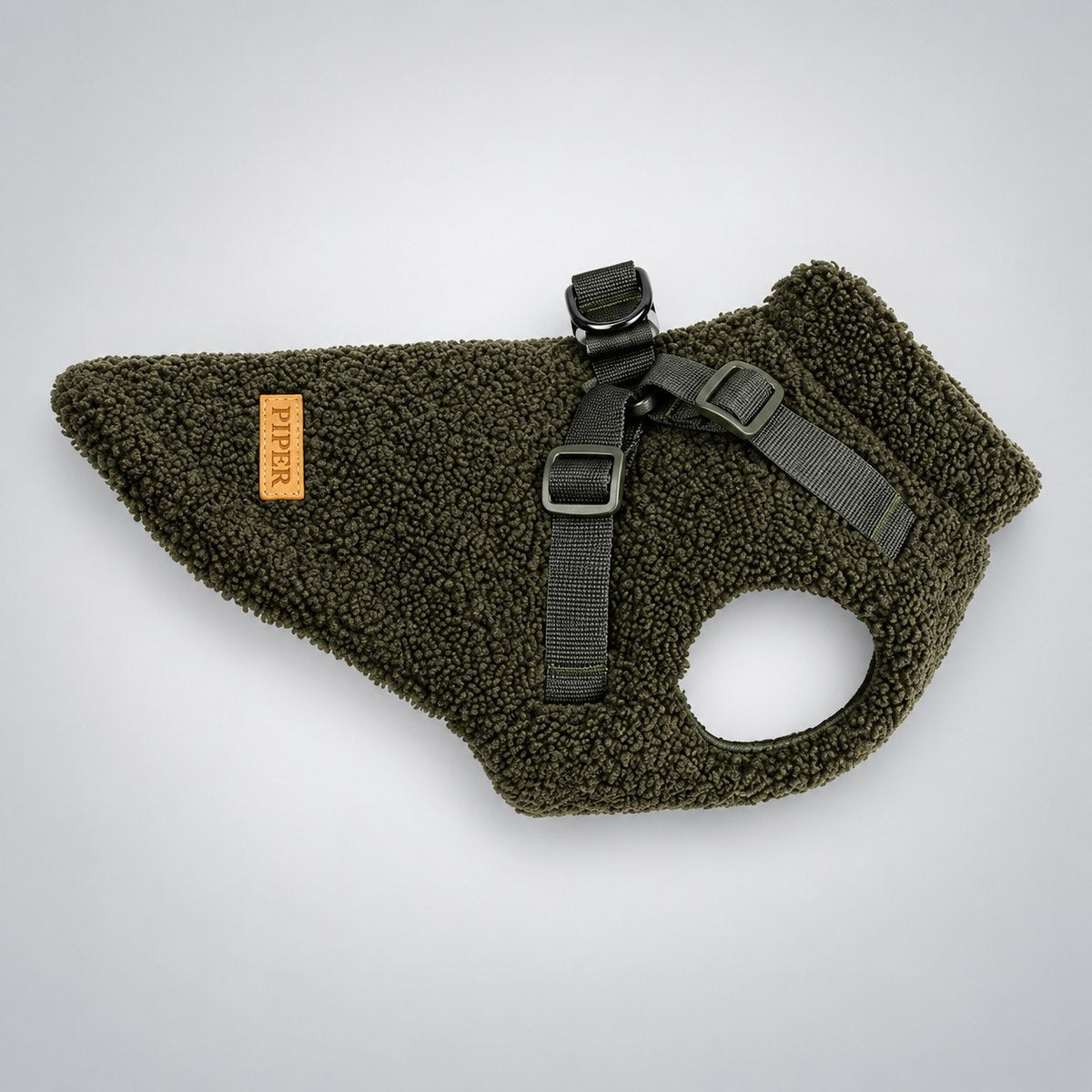 Deep Green teddy fleece dog vest shown flat with its harness straps visible.